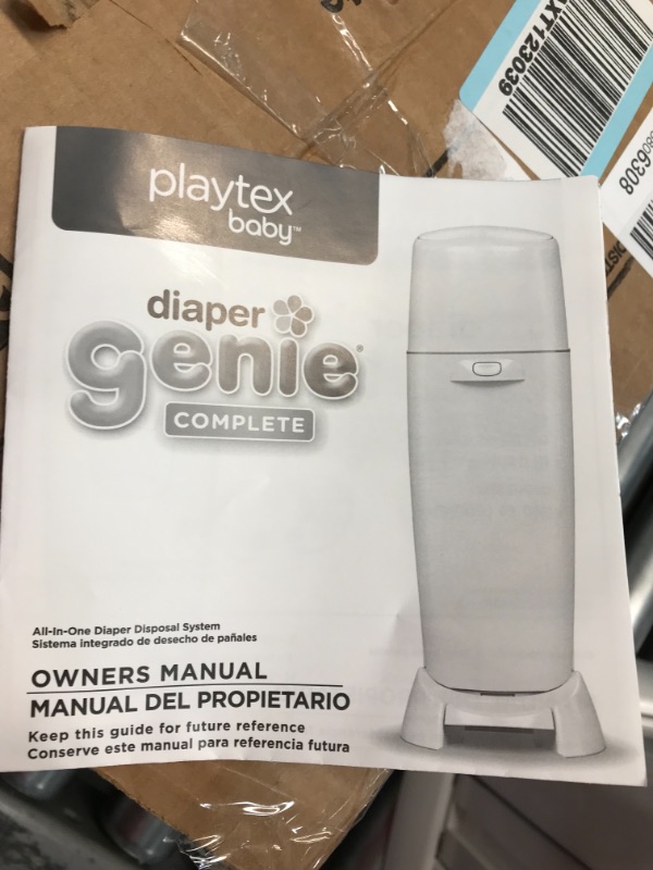 Photo 4 of Playtex Diaper Genie Complete Pail with Built-In Odor Controlling Antimicrobial, Includes Pail and 1 Clean Laundry Scent Refill, White Pail
//a bit jammed 