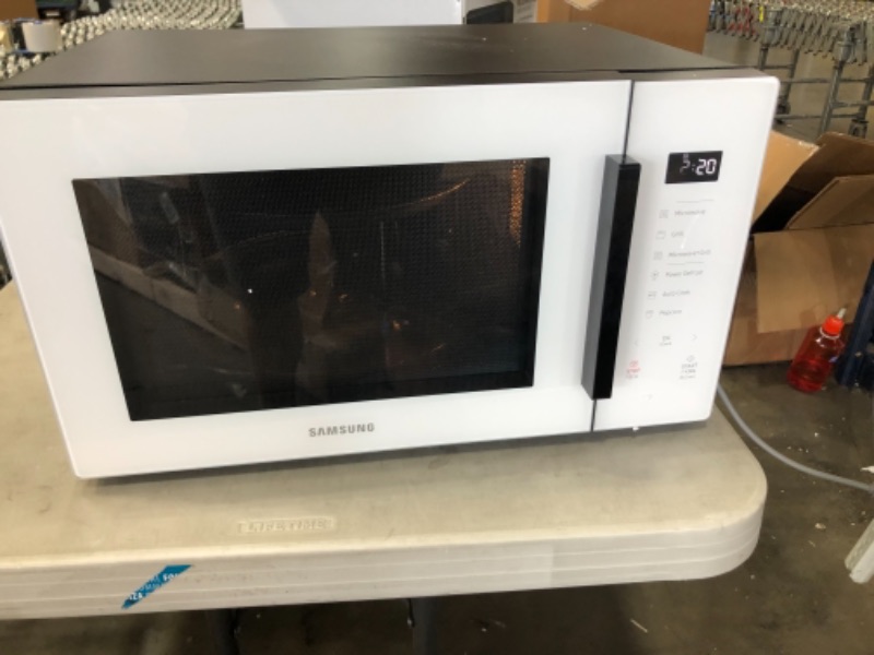 Photo 2 of (detaching side; closed door is not flush with sides) 
Samsung MG11T5018CW Counter Top Grill Microwave, 1.1 Cu. Ft, White