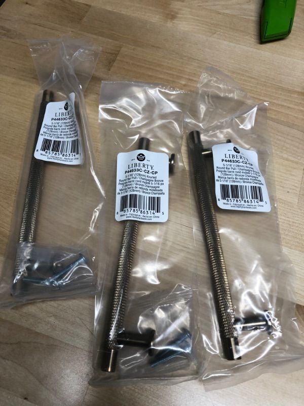 Photo 1 of **SET OF 3** Knurled 5-1/16 in. (128 mm) Champagne Bronze Bar Drawer Pull
