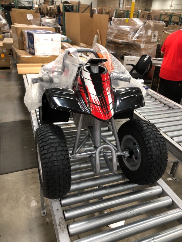 Photo 2 of Razor Dirt Quad - 24V Electric 4-Wheeler ATV - Twist-Grip Variable-Speed Acceleration Control, Hand-Operated Disc Brake, 12" Knobby Air-Filled Tires
