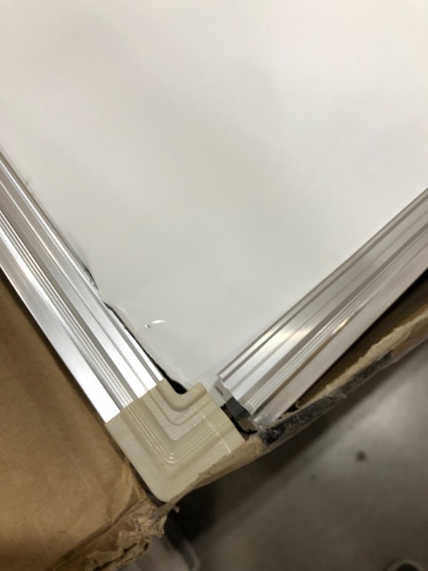 Photo 3 of large mobile double-sided whiteboard 60x40//item is damaged//small dents 