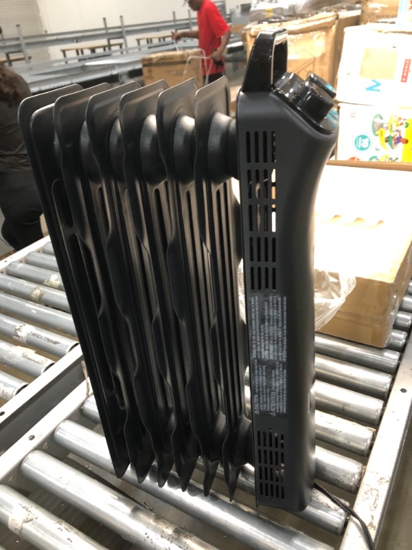 Photo 3 of Amazon Basics Portable Radiator Heater with 7 Wavy Fins, Manual Control, Black, 1500W

//tested powers on
