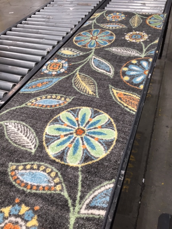 Photo 1 of 2' X 9' FLORAL BLACK RUG