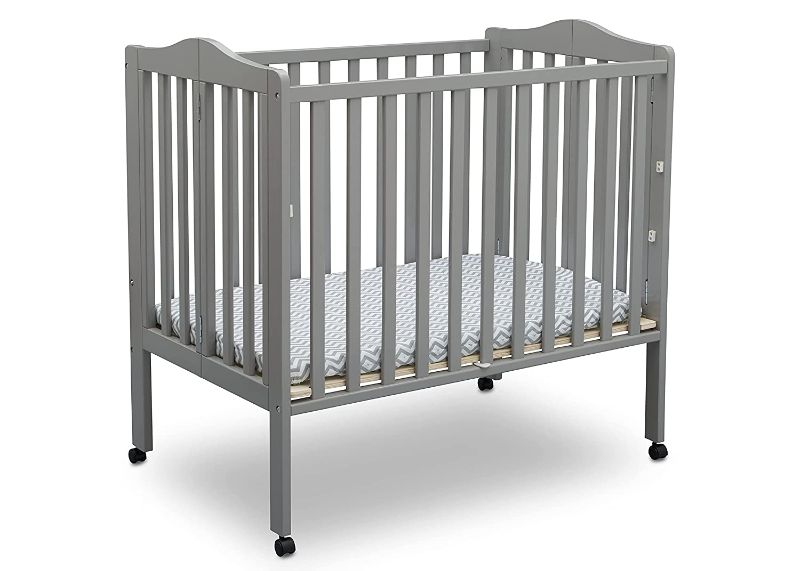 Photo 1 of Delta Children Folding Portable Mini Baby Crib with 1.5-inch Mattress, Grey
