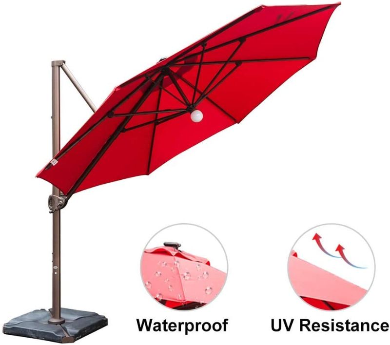 Photo 1 of Abba Patio 11 ft Solar Lights Patio Offset Hanging Umbrella Cantilever Umbrella with Easy Tilt & Cross Base for Garden, Deck, Backyard, Pool, Red
