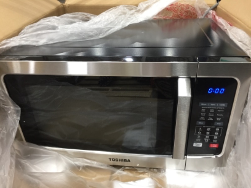 Photo 4 of Toshiba EC042A5C-SS Countertop Microwave Oven with Convection, Smart Sensor, Sound On/Off Function and LCD Display, 1.5 Cu.ft, Stainless Steel

//TESTED AND FUNCTIONAL 
