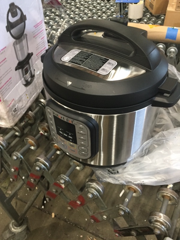 Photo 2 of NOT FUNCTIONAL PARTS ONLY DID NOT POWER ON 
Instant Pot Duo 7-in-1 Electric Pressure Cooker, Slow Cooker, Rice Cooker, Steamer, Sauté, Yogurt Maker, Warmer & Sterilizer, 6 Quart, Stainless Steel/Black