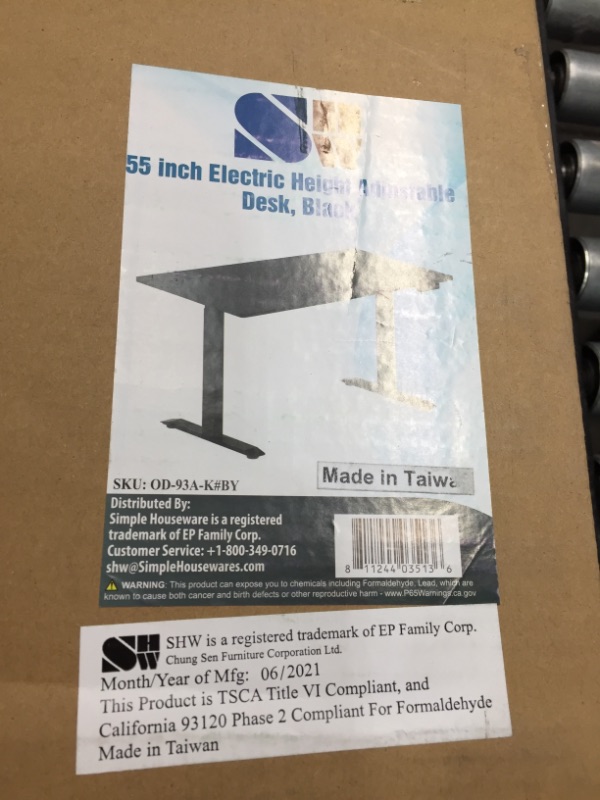 Photo 1 of SHW 55-Inch Large Electric Height Adjustable Standing Desk, 55 x 28 Inches, Black
