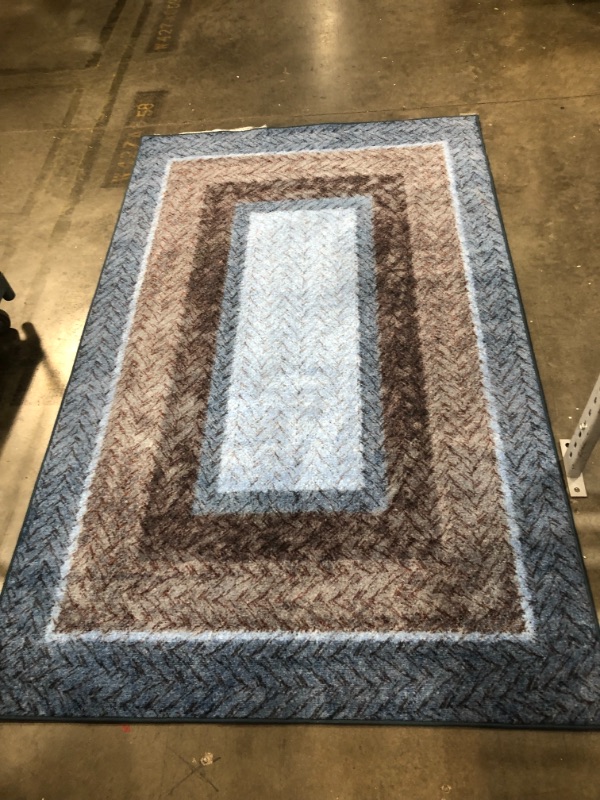 Photo 1 of 9 x 5 ft non slip rug blue and brown