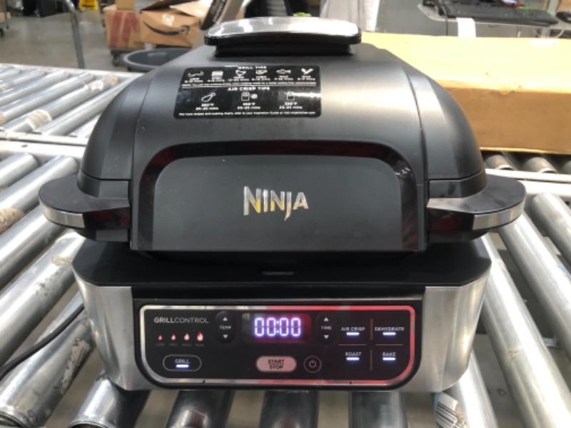 Photo 2 of Ninja Foodi AG301 5-in-1 Indoor Electric Countertop Grill with 4-Quart Air Fryer, Roast, Bake, Dehydrate, and Cyclonic Grilling Technology **POWERS ON