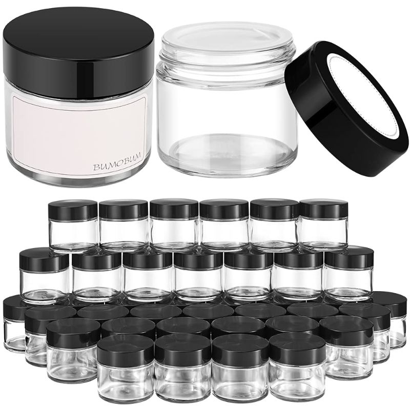 Photo 1 of 2 oz Round Clear Glass Jars, Bumobum 40 pack Cream Jars with Black Lids, Black and White Labels & Inner Liners, Empty Cosmetic Containers for Cream, Lotion
