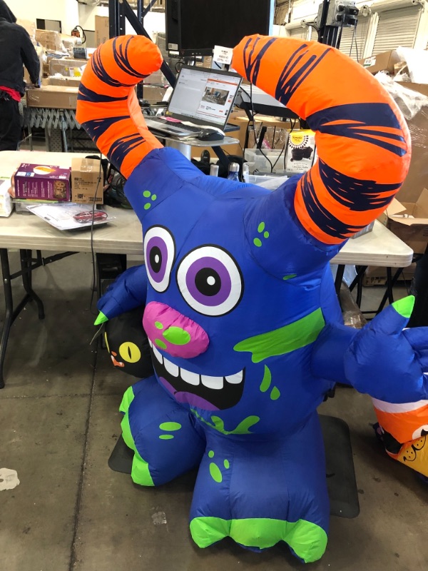 Photo 2 of 4.5 ft. Doodle Monster with Candy Bucket Airblown Halloween Inflatable
