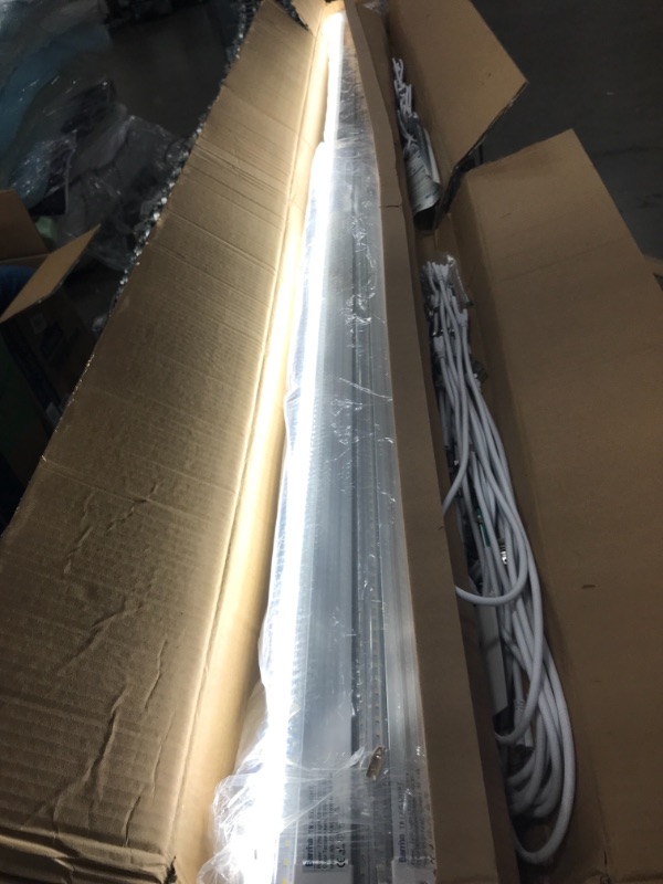 Photo 2 of Barrina LED Shop Light, 8FT 72W 9000LM 5000K, Daylight White, V Shape, Clear Cover, Hight Output, Linkable Shop Lights, T8 LED Tube Lights, LED Shop Lights for Garage 8 Foot with Plug (Pack of 10) DENTED.
