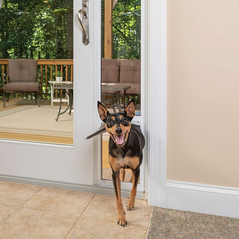 Photo 1 of *USED*
*MISSING hardware* 
PetSafe 1-Piece Sliding Glass Door for Dogs and Cats - Fits 81 in to 96 in Patio Panel Sliding Glass Doors - Adjustable Frame - No Cutting DIY Installation - Pet Door Great for Apartments and Rentals, Medium
