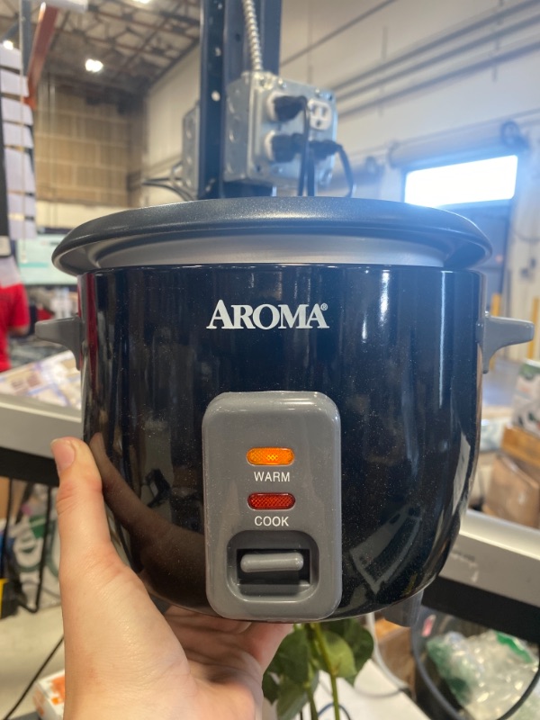 Photo 2 of 6-Cup Black Rice Cooker with Removable Steam Tray AS IS USED, POT DOESNT SIT COPLETELY IN, PLEASE REFER TO PHOTOS, (MINOR FIX) 