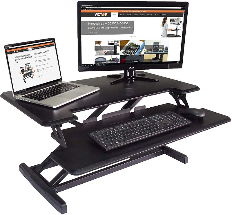 Photo 1 of Victor DCX610 Height Adjustable Compact Standing Desk| Black| 33” Wide Sit-Stand Dual Monitor Desk and Laptop Riser Workstation| Compatible with Most Monitor Arms

//opened not used