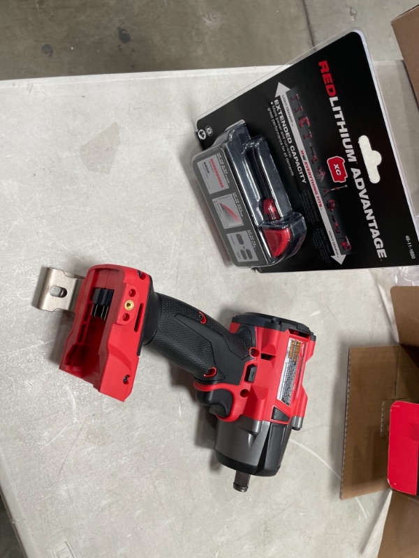 Photo 5 of 1/2" Drive 18 Volt Pistol Grip Cordless Impact Wrench & Ratchet with MILWAUKEE'S 48-11-1850 M18 Redlithium 5.0Ah Bat Pack
