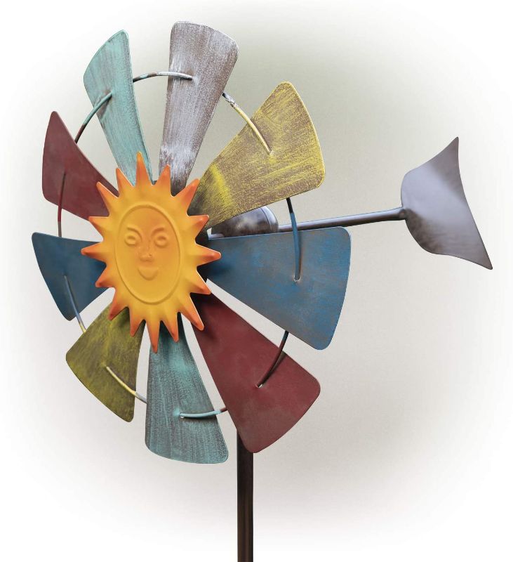 Photo 1 of Alpine Corporation 71" Sun Face Windmill Stake Kinetic Spinner Outdoor Yard Art Décor, Red, White, Yellow and Blue