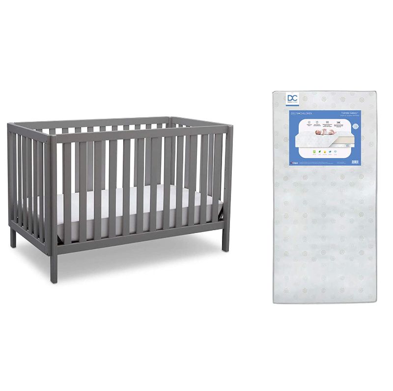 Photo 1 of Delta Children Milo 3-in-1 Convertible Crib, Grey + Delta Children Twinkle Galaxy Dual Sided Recycled Fiber Core Crib and Toddler Mattress (Bundle)
