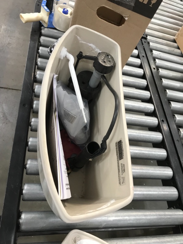 Photo 1 of American Standard Cadet 3 1.28 gpf 10-Inch Rough Toilet Tank Only, Bone Bone

