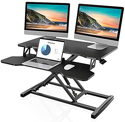 Photo 1 of FITUEYES Height Adjustable Standing Desk Converter 32” Wide Sit to Stand Desk Tabletop Workstation SD308001WB
