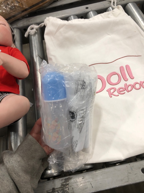 Photo 1 of DOLL REBORN - BABY BOY INCLUDED WITH A BOTTLE, BINKY, AND DIAPERS