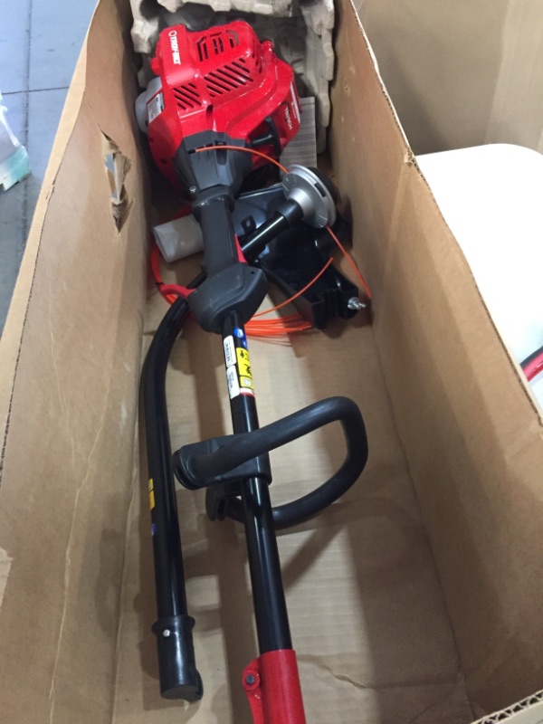 Photo 4 of **NEEDS GAS**25 cc Gas 2-Cycle Curved Shaft Trimmer with Attachment Capabilities
