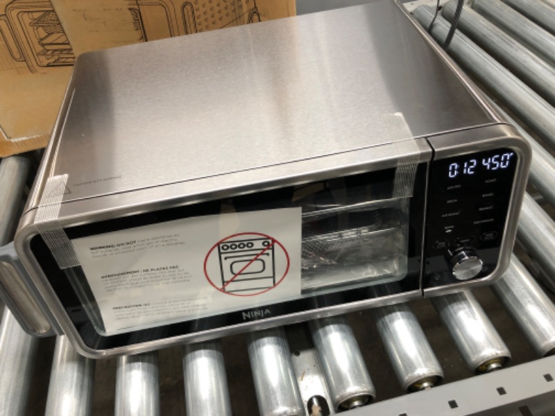 Photo 2 of Ninja SP201 Digital Air Fry Pro Countertop 8-in-1 Oven with Extended Height, XL Capacity, Flip Up & Away Capability for Storage Space, with Air Fry Basket, Wire Rack & Crumb Tray, Silver
