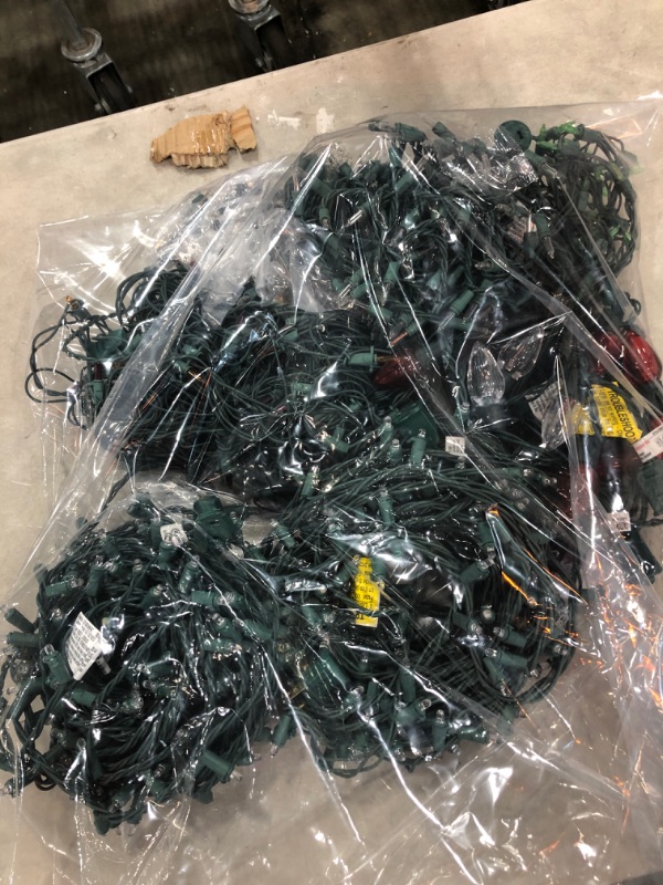 Photo 1 of *SOLD AS IS*
BAG OF ASSORTED HALF WORKING LIGHTS 
