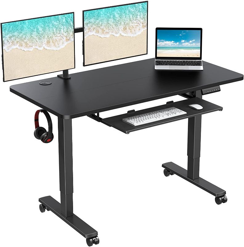 Photo 1 of WOKA Electric Standing Desk Adjustable Height 55x24 in with Memory Controller, Ergonomic Motorized Standing Desk with Keyboard Tray, Rising Desk for Home Office Sit Stand Desk
