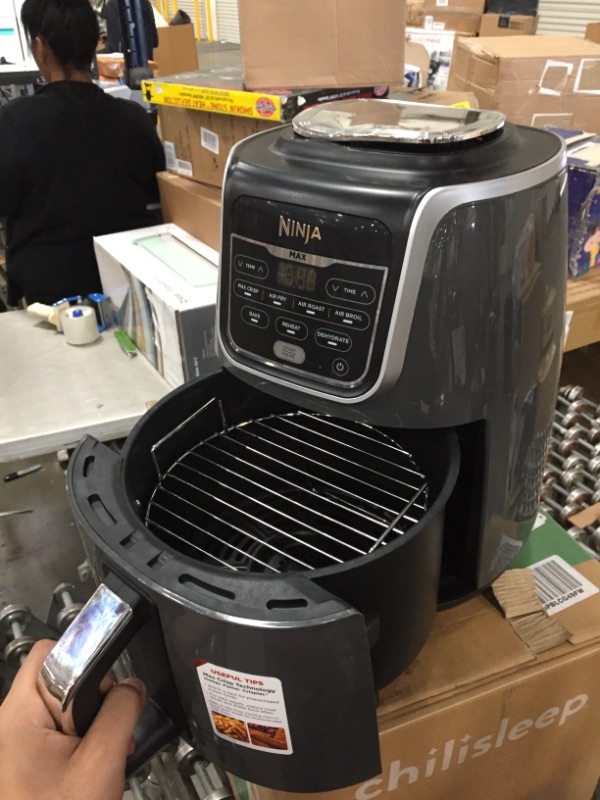 Photo 1 of Ninja AF150AMZ Air Fryer XL, 5.5 Qt. Capacity that can Air Fry, Air Roast, Bake, Reheat & Dehydrate, with Dishwasher Safe, Nonstick Basket & Crisper Plate and a Chef-Inspired Recipe Guide, Grey
**USED**
