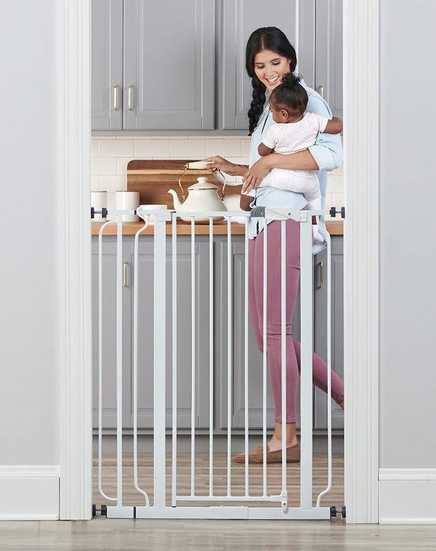 Photo 1 of Regalo Easy Step 36" Extra Tall Walk Thru Baby Gate, Includes 4-Inch Extension Kit, 4 Pack of Pressure Mount Kit and 4 Pack Wall Cups and Mounting Kit
