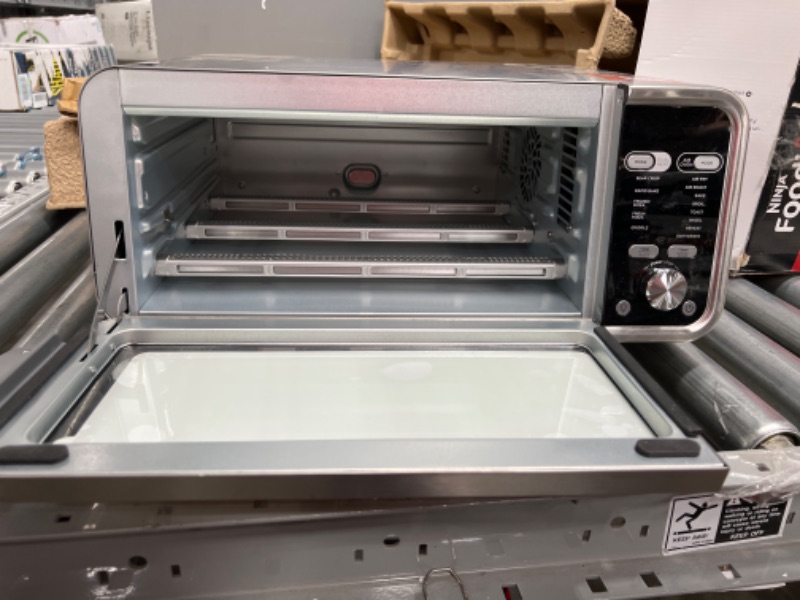 Photo 3 of Ninja SP301 Dual Heat Air Fry Countertop 13-in-1 Oven with Extended Height, XL Capacity, Flip Up & Away Capability for Storage Space, with Air Fry Basket, SearPlate, Wire Rack & Crumb Tray, Silver
