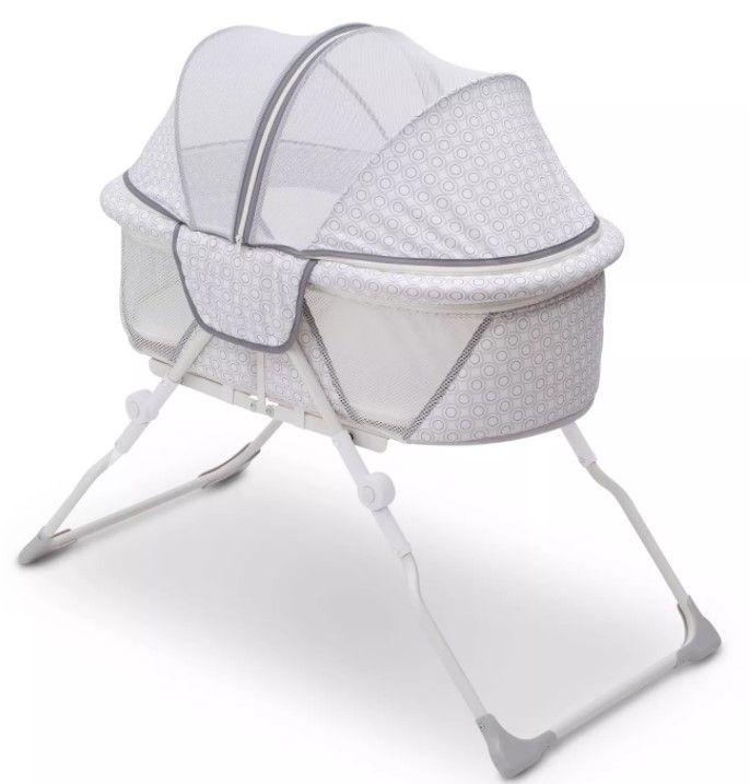 Photo 1 of Delta Children EZ Fold Ultra Compact Travel Bassinet
