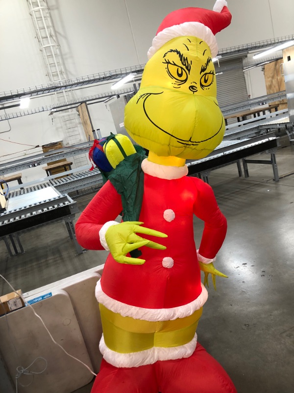 Photo 1 of Airblown 8 ft Pre-Lit LED Holiday Grinch in Santa Suit with Sack Christmas Inflatable
