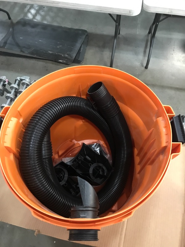 Photo 6 of RIDGID 12 Gal. 5.0-Peak HP NXT Wet/Dry Shop Vacuum with Filter, Hose and Accessories, Oranges/Peaches
**USED, FUNCTIONS**