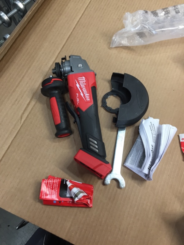 Photo 2 of Milwaukee 2880-20 M18 FUEL 4-1/2" / 5" Grinder No-Lock Paddle Switch, Tool Only
**NO GRINDER BLADE INCLUDED**