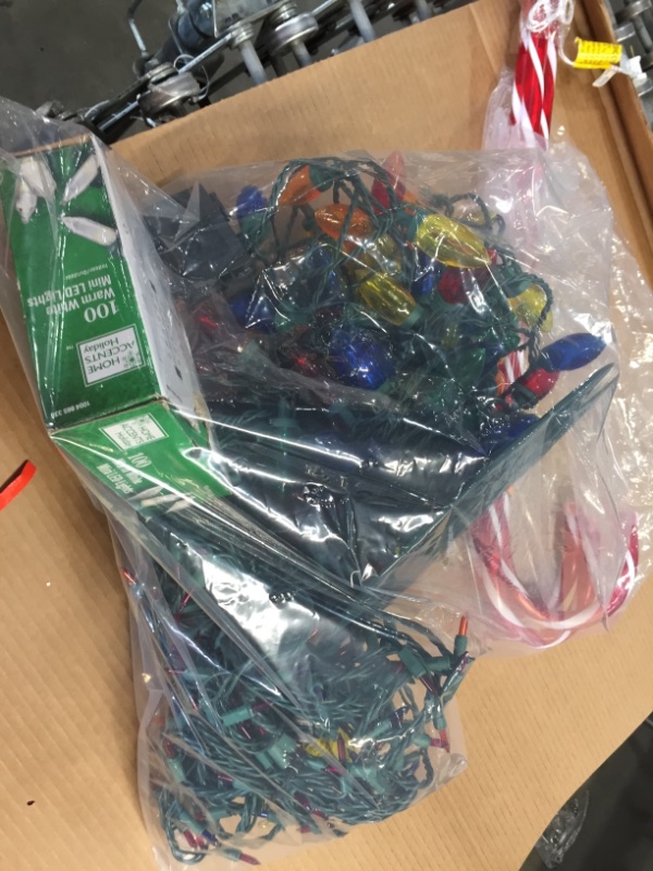 Photo 1 of ASSORTED BAG OF CHRISTMAS LIGHTS 
**USED CHRISTMAS LIGHTS FUNCTIONAL, NOT ALL COMPLETELY LIGHT UP, MINOR DAMAGE**