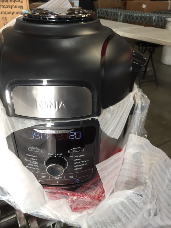 Photo 1 of Ninja FD401 Foodi 12-in-1 Deluxe XL 8 qt. Pressure Cooker & Air Fryer that Steams, Slow Cooks, Sears, Sautés, Dehydrates & More, with 5 qt. Crisper Basket, Deluxe Reversible Rack & Recipe Book, Silver

