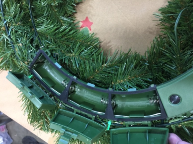 Photo 2 of National Tree 24 North Valley Spruce Wreath with 50 Battery Operated Dual LED Lights - Green
***requires batteries***snap for a battery case is broke, see pictures***