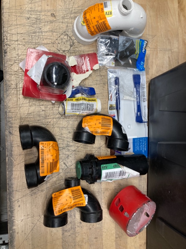 Photo 1 of   ***NON-REFUNDABLE** 
Assorted Pipe Connectors, Drill bits, and Trim Kit 