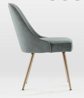 Photo 1 of *** STOCK PHOTO FOR REFERENCE ONLY***
Leather grey chair with gold metal legs
