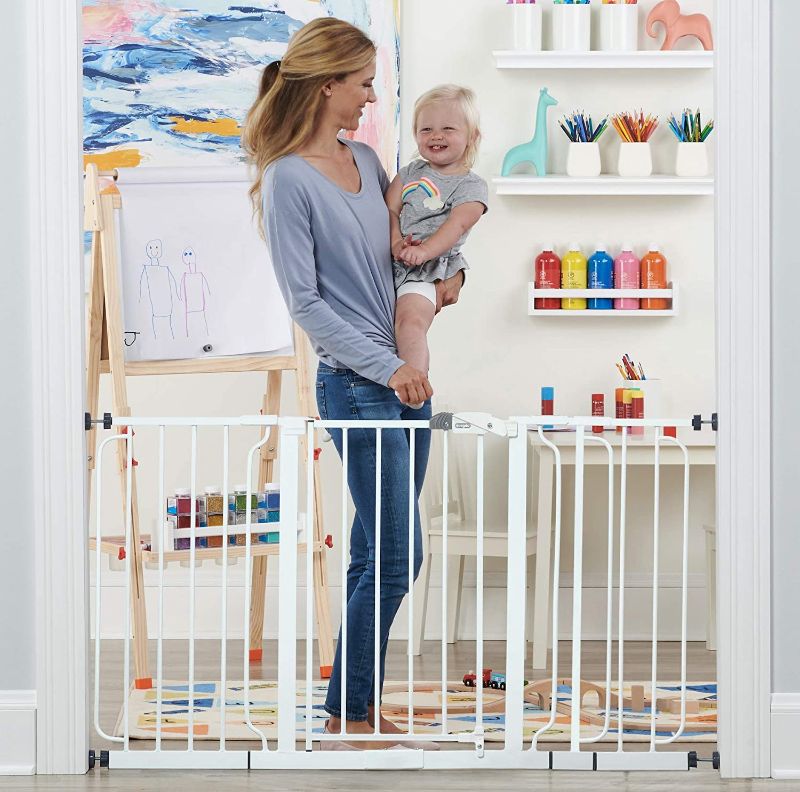 Photo 1 of Regalo 56-Inch Extra WideSpan Walk Through Baby Gate, Includes 4-Inch, 8-Inch and 12-Inch Extension, 4 Pack of Pressure Mounts and 4 Pack of Wall Cups and Mounting Kit, White
