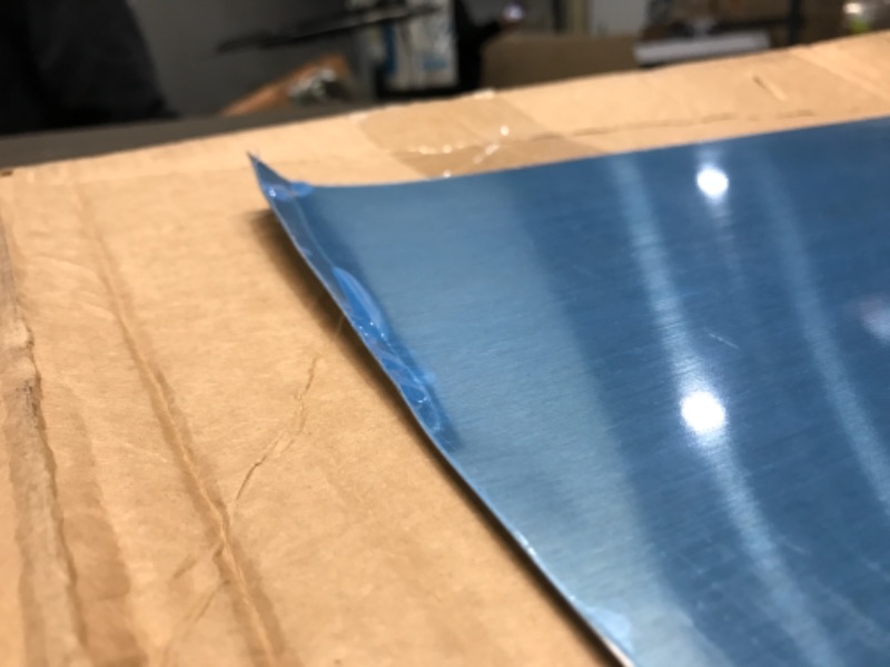 Photo 1 of  Reversible Stainless Steel Backsplash Range Hood Wall Shield for Kitchen, 24 by 30-Inch 2 CORNERS BENT.