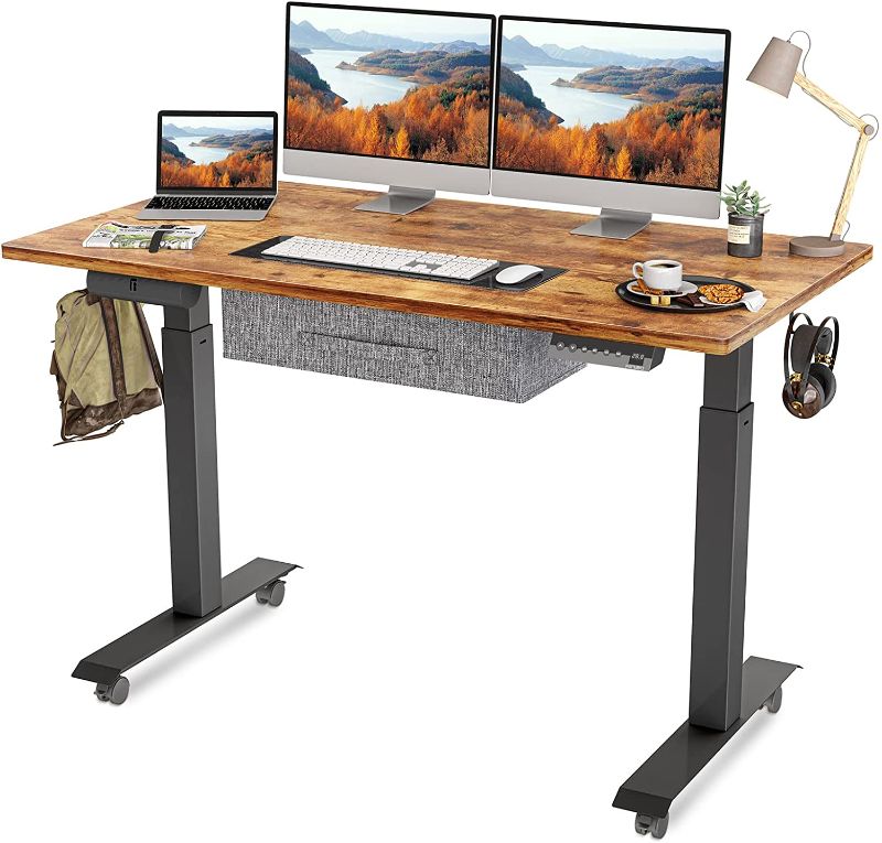 Photo 1 of FEZIBO Standing Desk with Drawer, Adjustable Height Electric Stand up Desk, 55 x 24 Inches Sit Stand Home Office Desk, Ergonomic Workstation Black Steel Frame/Rustic Brown Tabletop
