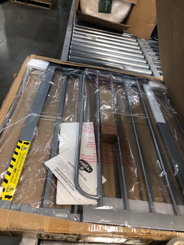 Photo 1 of Regalo Easy Step 49-Inch Extra Wide Baby Gate, Includes 4-Inch and 12-Inch Extension Kit, 4 Pack of Pressure Mount Kit and 4 Pack of Wall Mount Kit, Platinum
