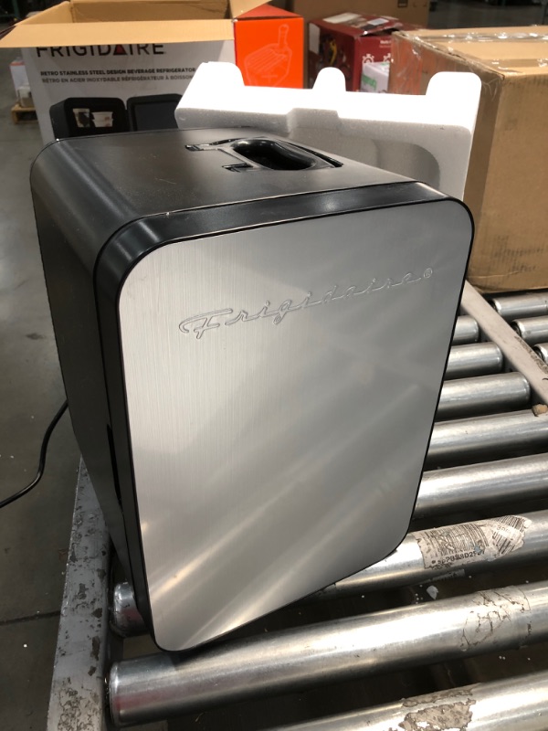 Photo 2 of **TESTED AND FUNCTIONS**
FRIGIDAIRE Portable 10L, 15-can Mini Fridge Brushed Stainless Rugged Refrigerator, EFMIS183-SS