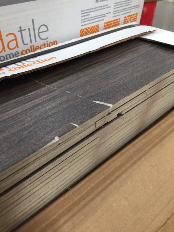 Photo 3 of **DAMAGED**
Burlington Walnut 6 in. x 24 in. Porcelain Floor and Wall Tile (14 sq. ft. / case) (22 CASES)
***SOME BROKEN OFF***
