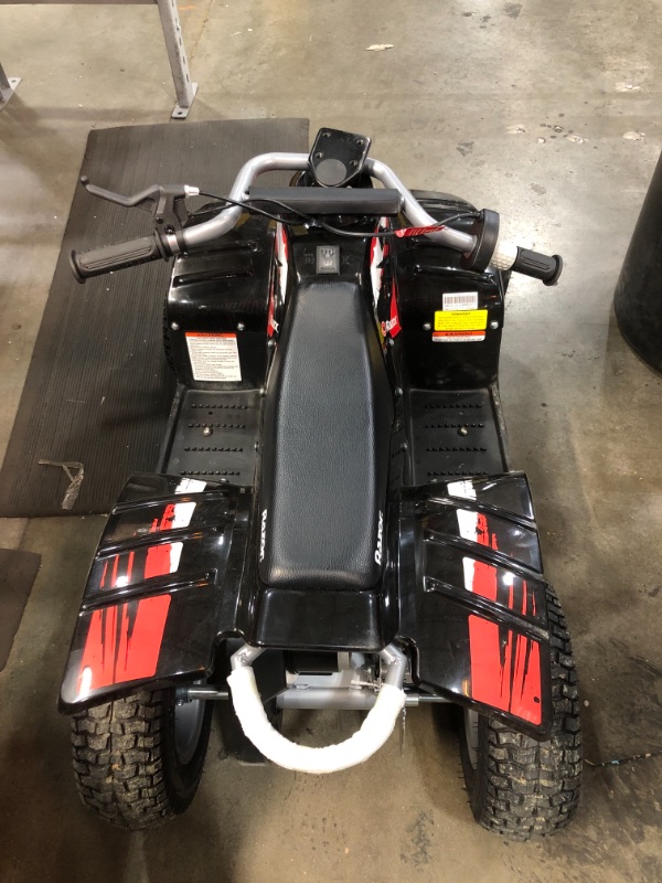 Photo 2 of  Razor Dirt Quad - 24V Electric 4-Wheeler ATV - Twist-Grip Variable-Speed Acceleration Control, Hand-Operated Disc Brake, 12" Knobby Air-Filled Tires