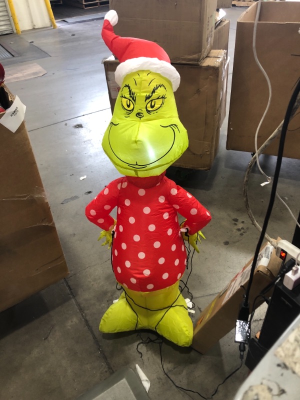 Photo 2 of 4 ft Pre-Lit LED Grinch with Polka Dot Sweater and Santa Hat Christmas Inflatable
